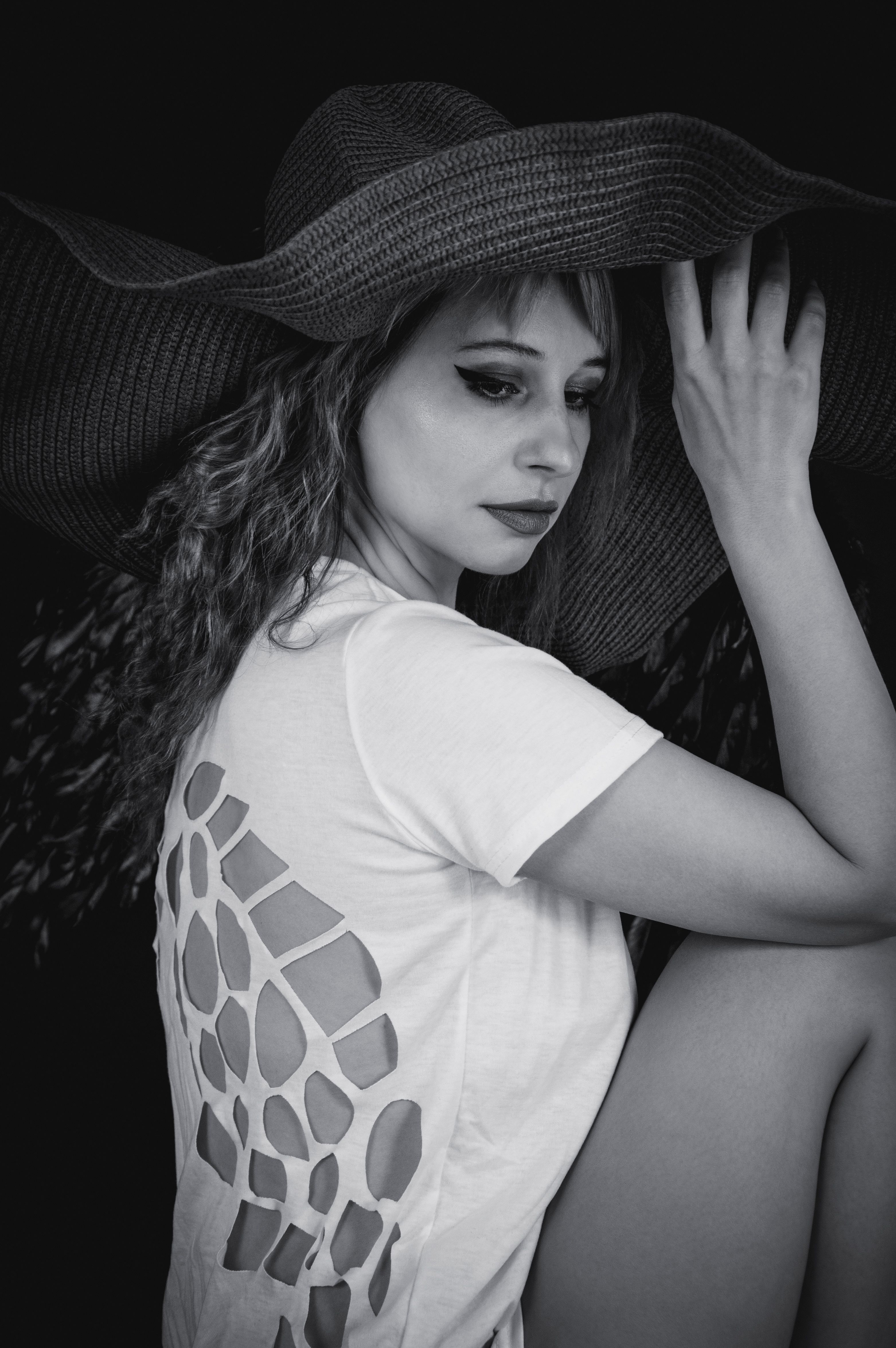 Black and White Photo of a Woman in a Hat · Free Stock Photo