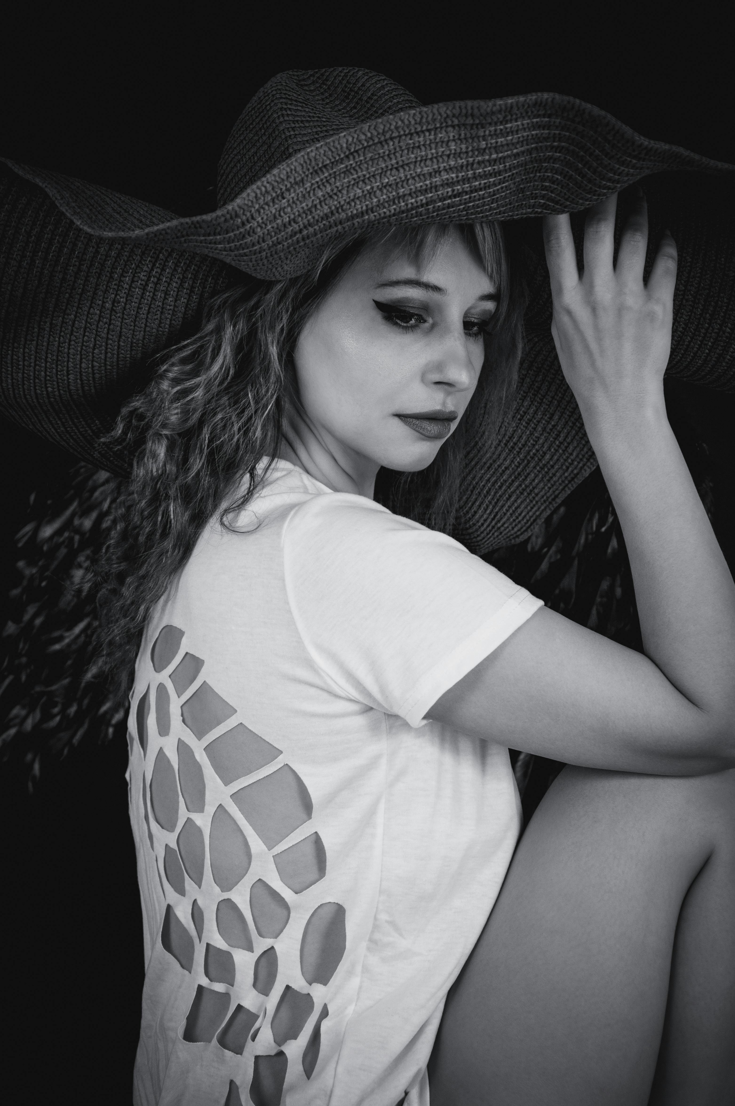 Woman Posing In A Large Round Hat · Free Stock Photo