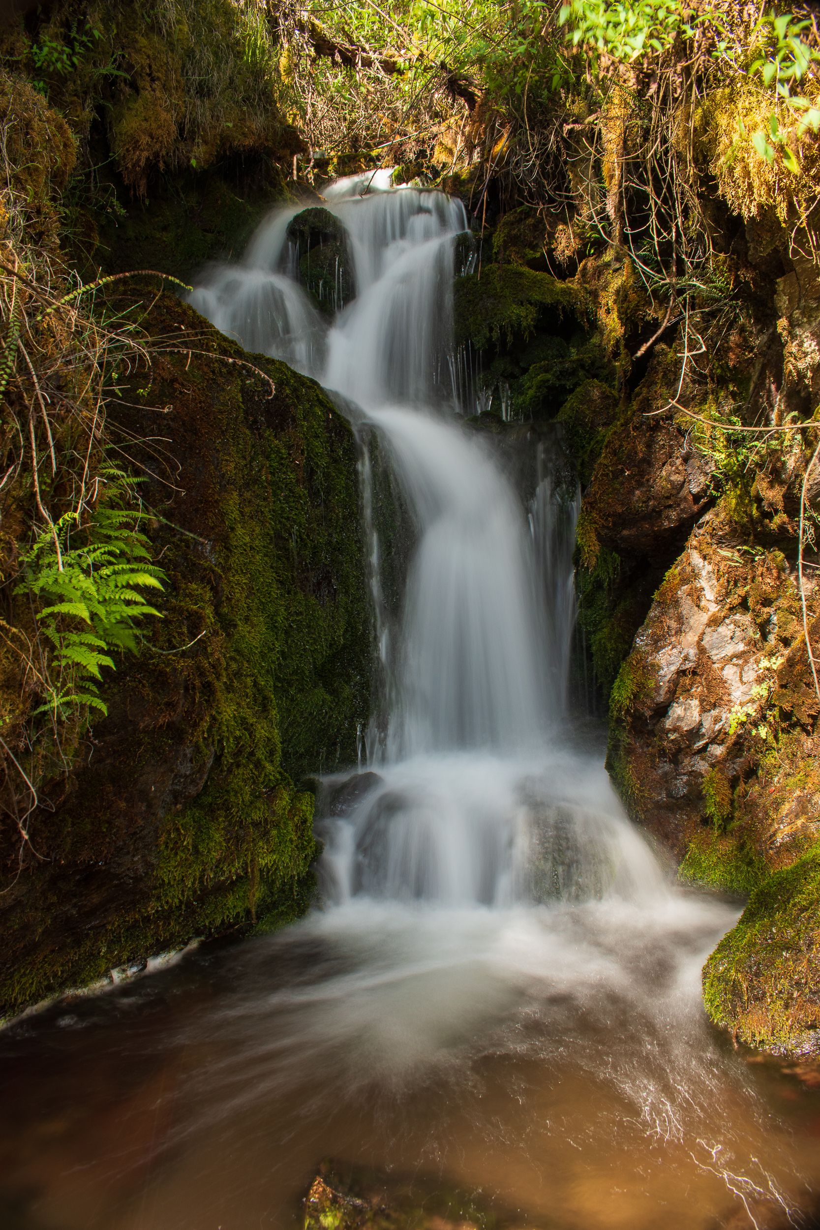 A waterfall captured in long exposure in Urubamba, Peru