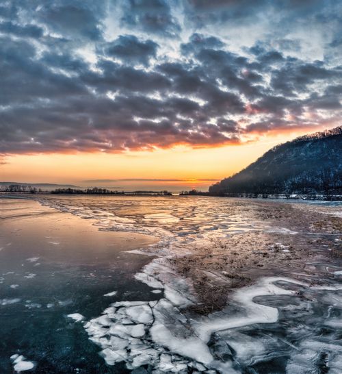 Free Beautiful winter view of a frozen river in Minneiska, Minnesota at sunset. Stock Photo