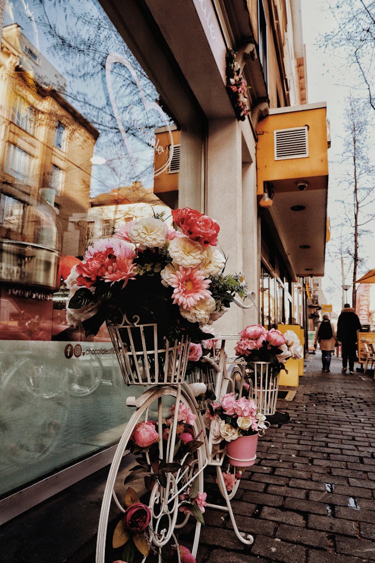 Bike With Bouquet Of Flowers On A Street 