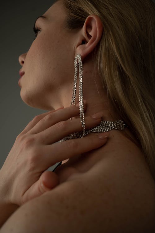 Woman with Diamond Earrings and a Necklace