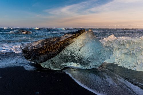 Free Captivating view of ice blocks on a black sand beach in Kirkjubæjarklaustur, Iceland. Stock Photo
