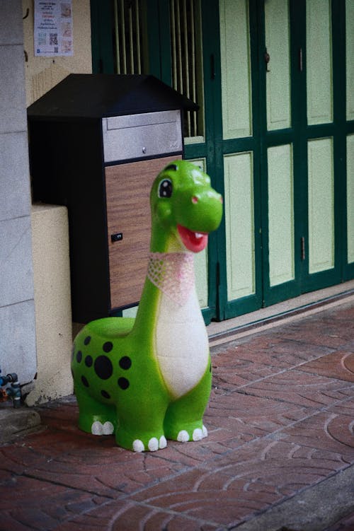 Dinosaur Toy on Sidewalk