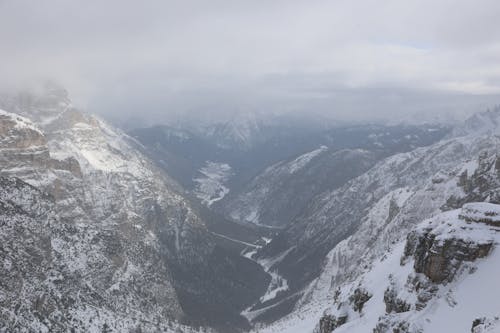 Clouds over Valley in Mountains in Winter