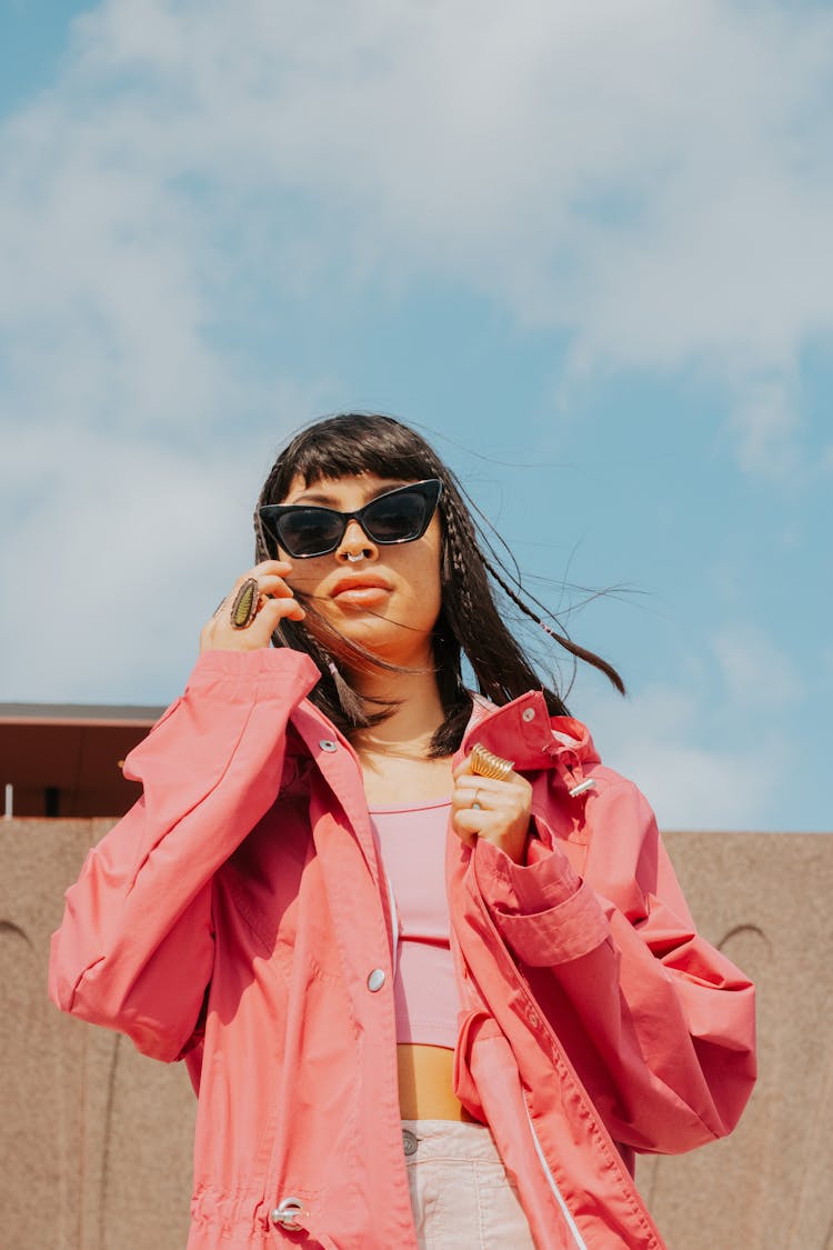 Brunette With Bangs In Sunglasses On Beach