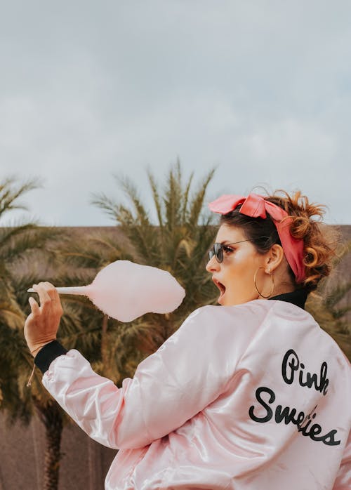 Woman Eating Cotton Candy 
