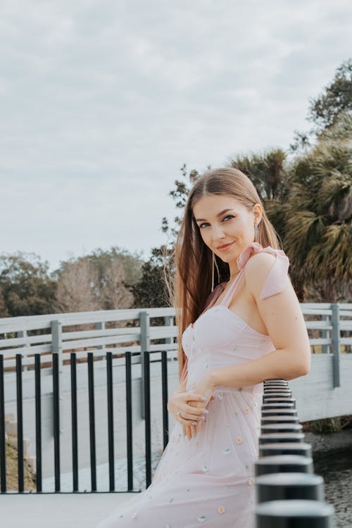 Smiling Woman in Pink Dress