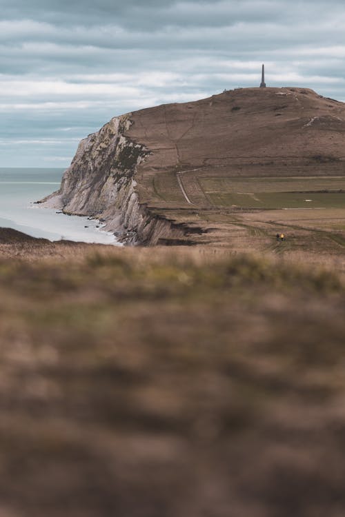 Kostnadsfri bild av hav, klippa, kulle