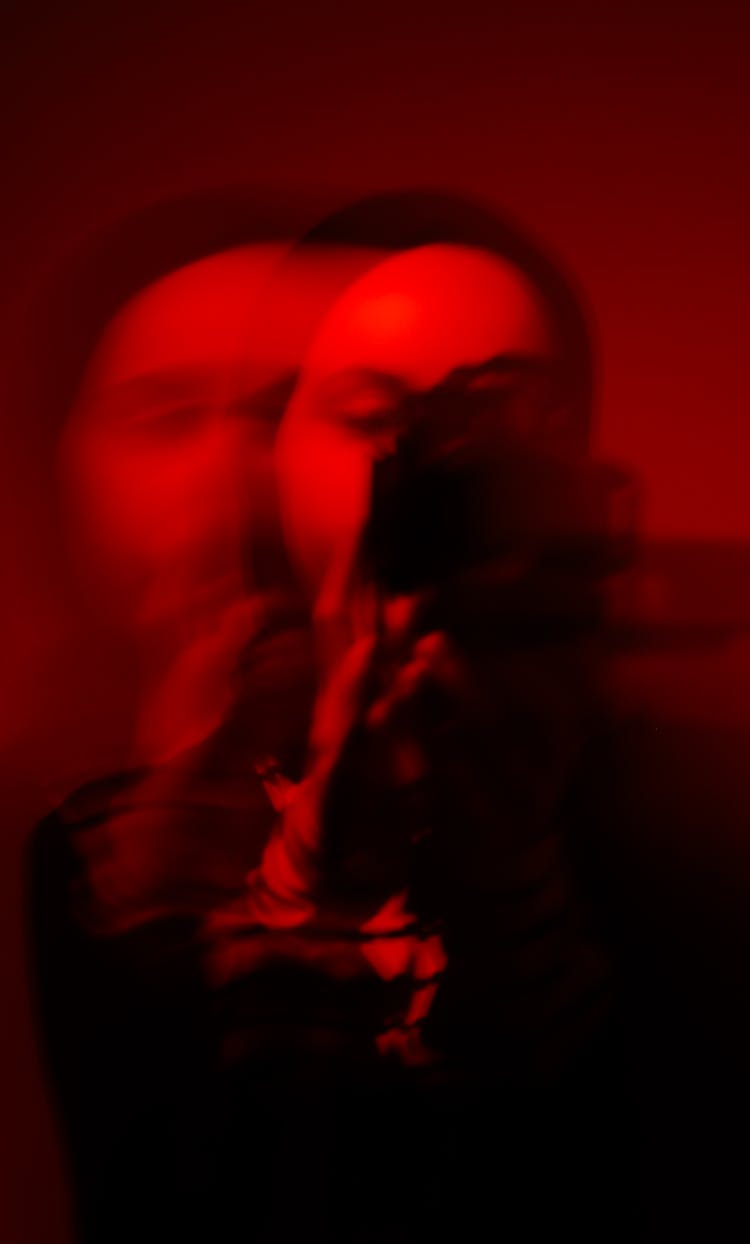 Shot Of Person With Blurred Face Holding Camera