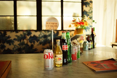 Cans and Bottles of Drinks in a Row