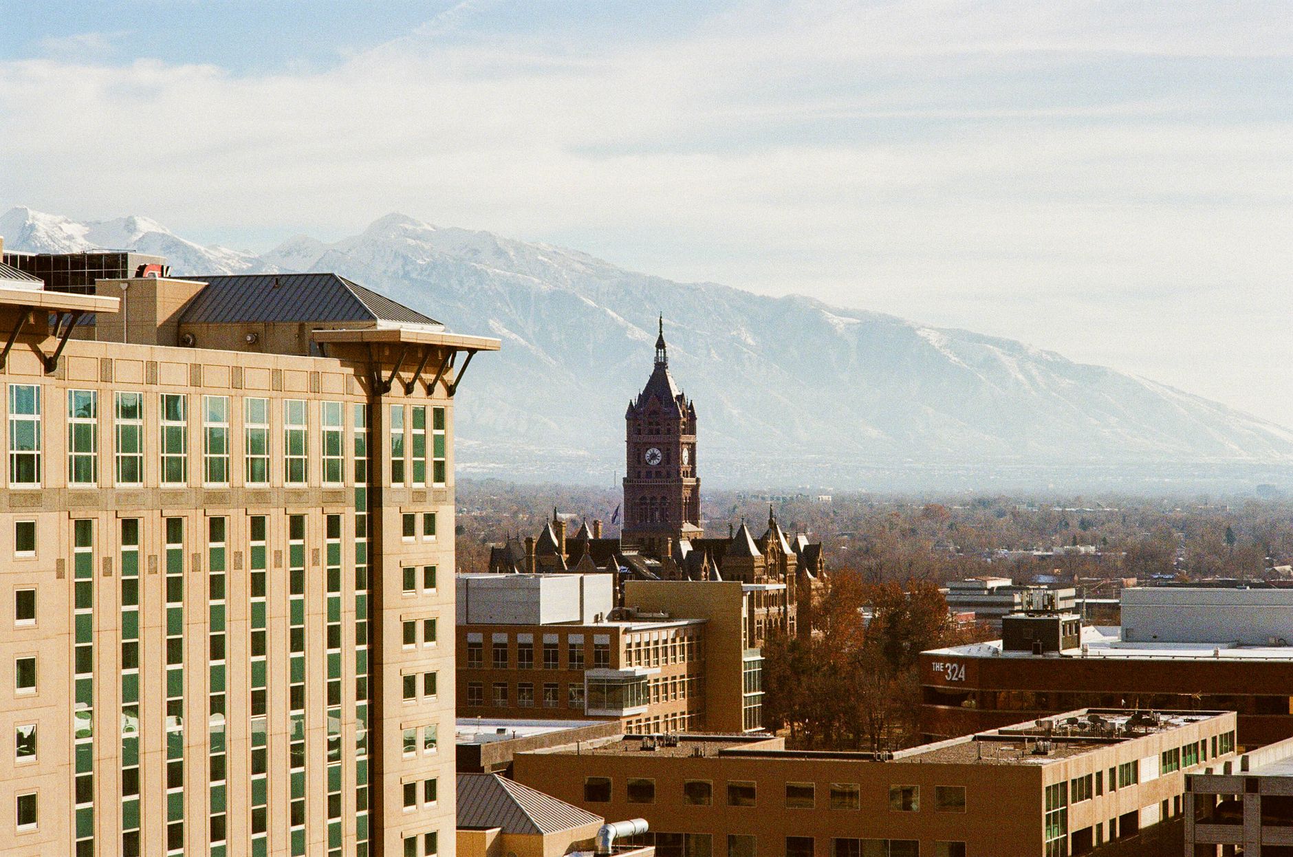 Stunning view of Salt Lake City's iconic skyline and clock tower against majestic mountains.