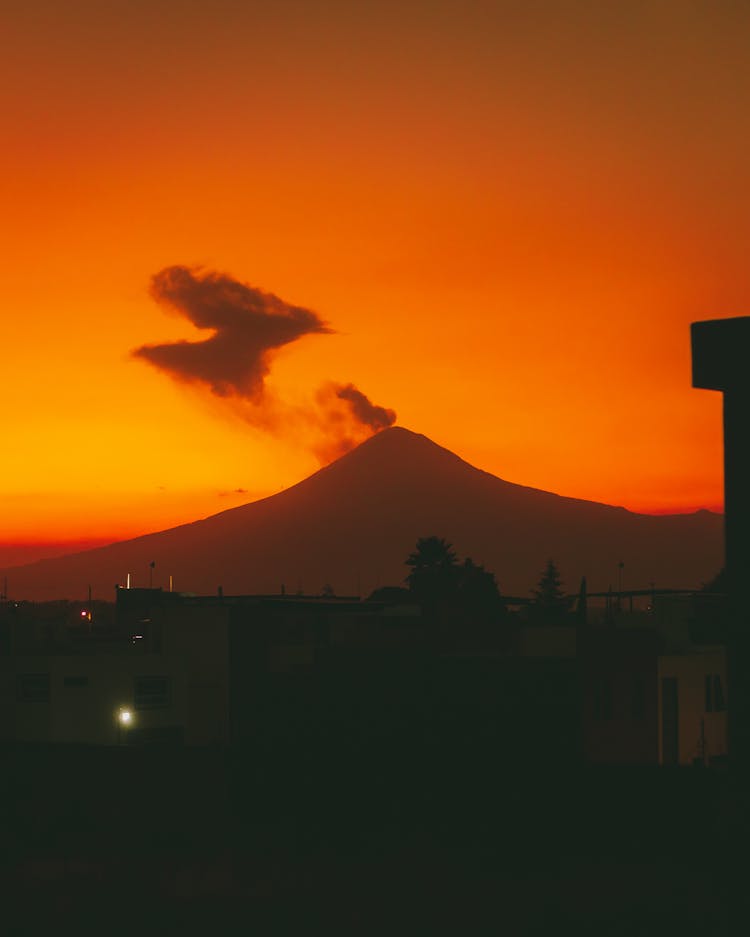 Silhouetted Volcano At Sunset 