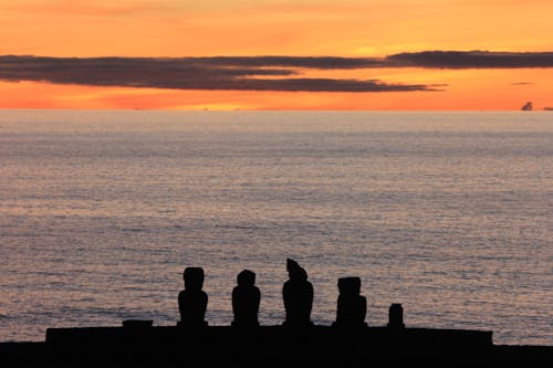 Silhouette of Stones by the Sea During Sunset 