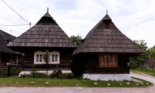 Free Rustic wooden houses in Podbiel, illustrating Slovak folk architecture. Stock Photo