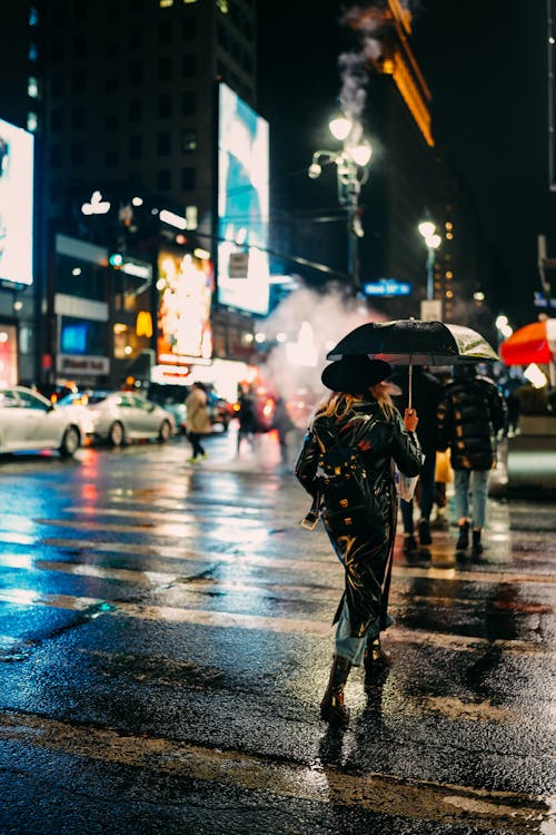People Walking on City Street during Nighttime