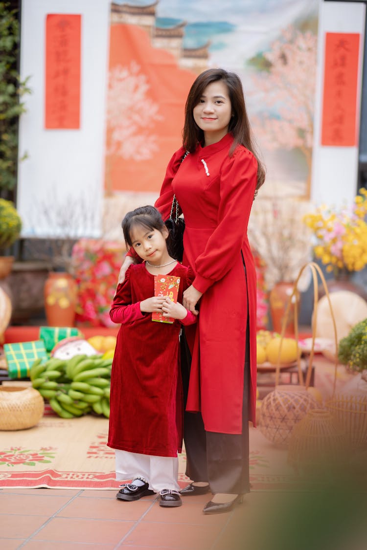 Woman And Child In Traditional Dresses