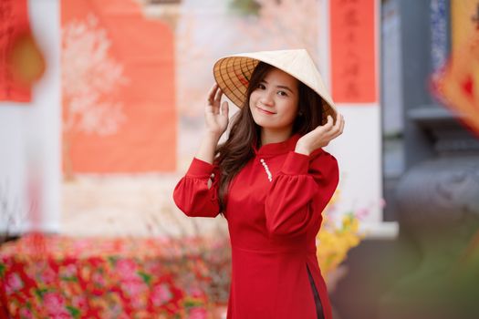 Smiling Woman Posing in Traditional Conical Hat