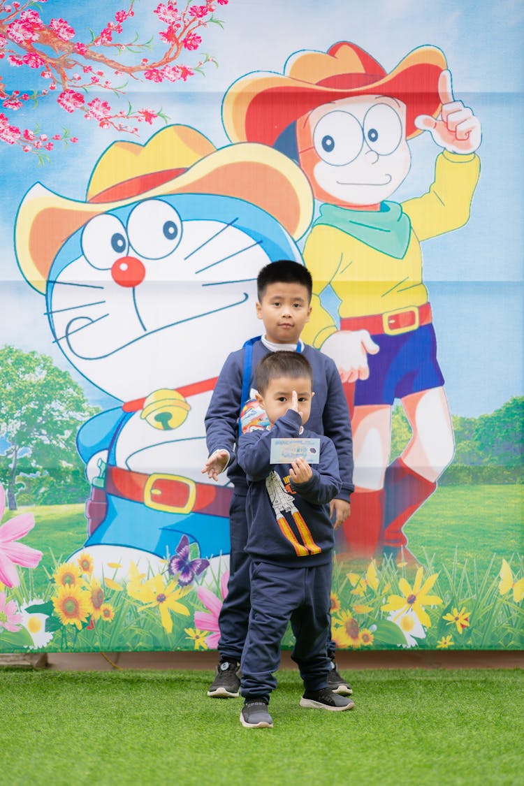 Boys Posing By A Mural