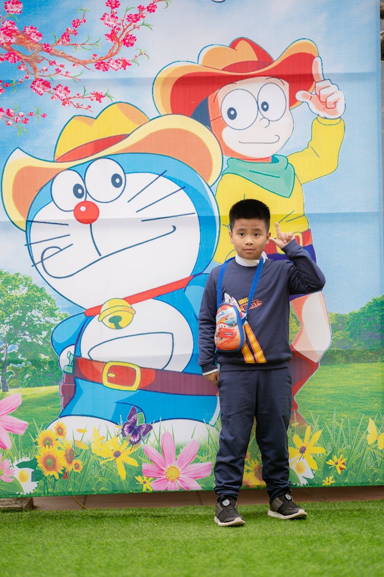 Boy Posing By Wall With Colorful Mural