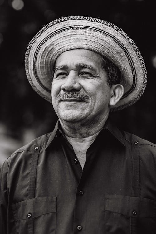 Man Wearing Hat and Collared Shirt