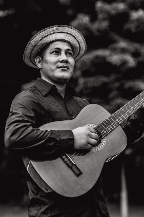 Grayscale Photography of Man Playing Guitar