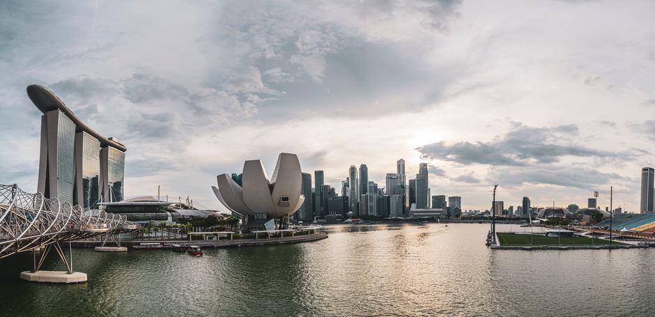 Panoramic view of Singapore skyline featuring modern architecture along the waterfront.