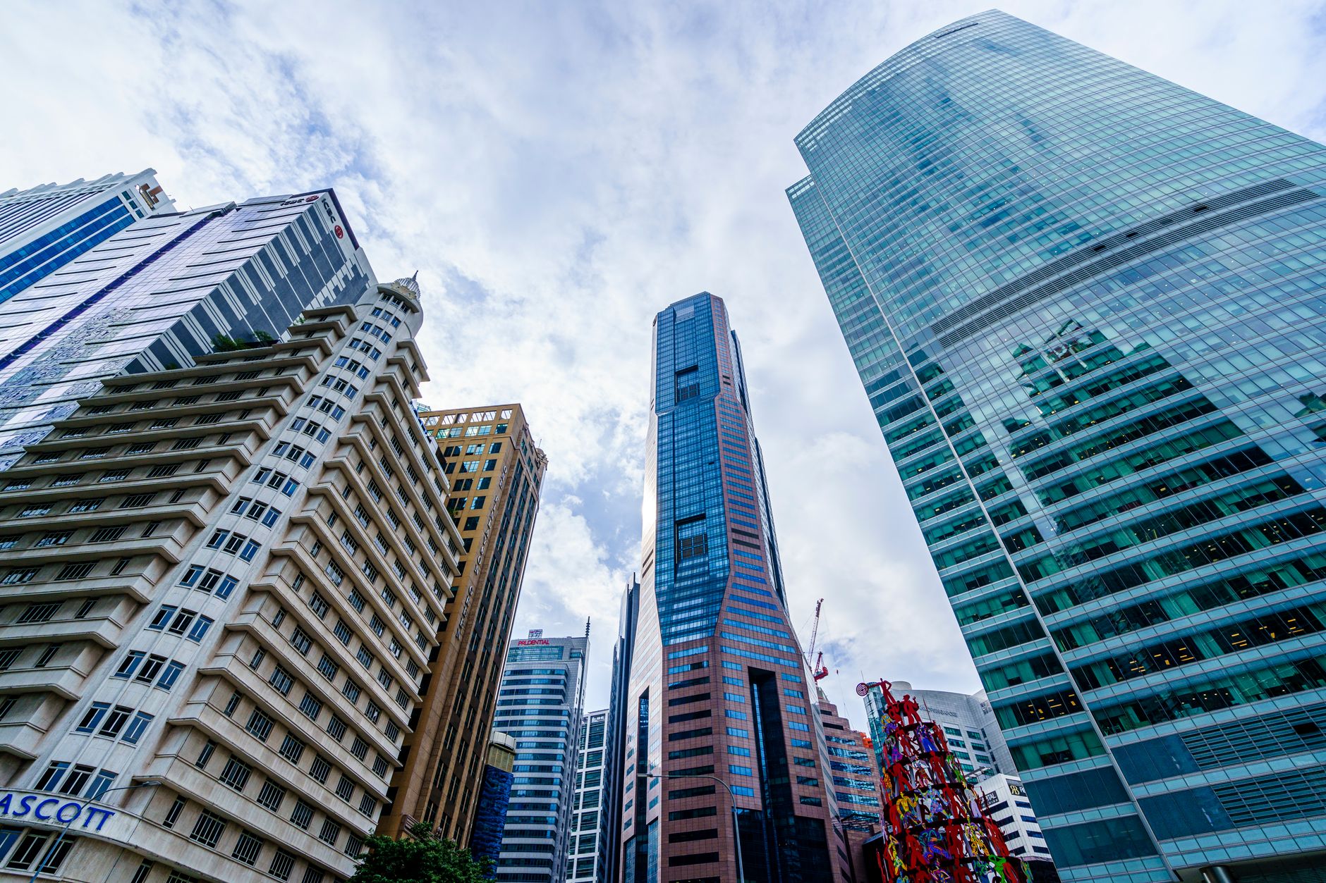 Low angle view of skyscrapers showcasing modern architecture in downtown Singapore.