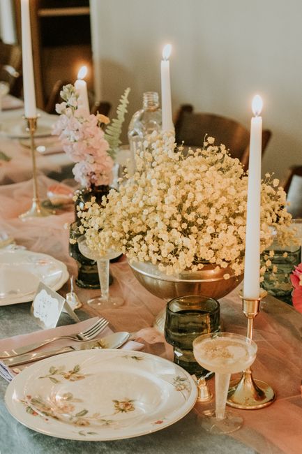 An elegant wedding table setting with floral decor and candlelight, perfect for a romantic celebration.