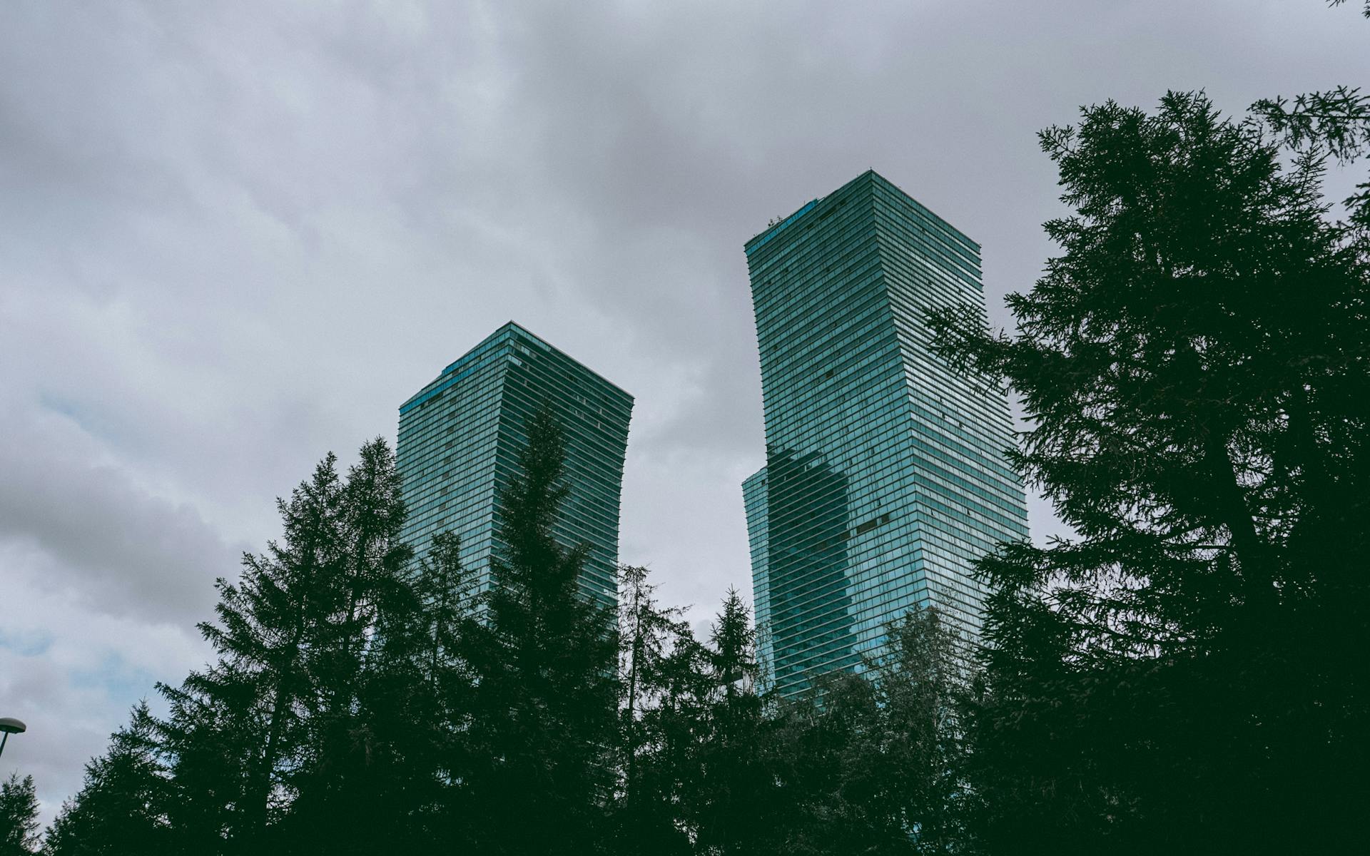 Elegant modern skyscrapers in Astana, Kazakhstan captured against a cloudy sky.