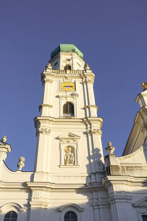 Free Close-up view of the elegant St. Stephen's Cathedral bell tower, bathed in sunlight in Passau, Germany. Stock Photo