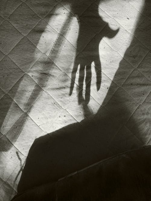 Shadow of Hand on Mattress
