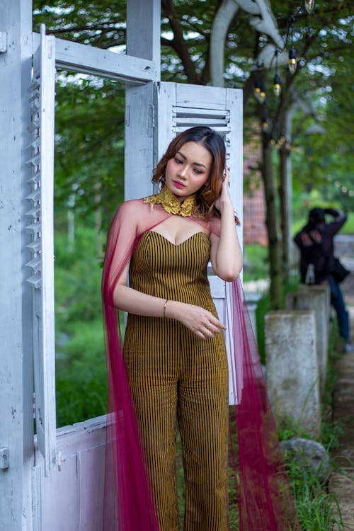 Woman in Fashionable Clothing Posing Outdoors 