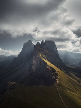 Stunning view of Seceda mountain in the Dolomites, Italy with dramatic clouds.