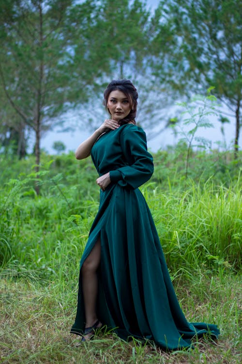 Woman in a Green Dress Posing Outdoors 