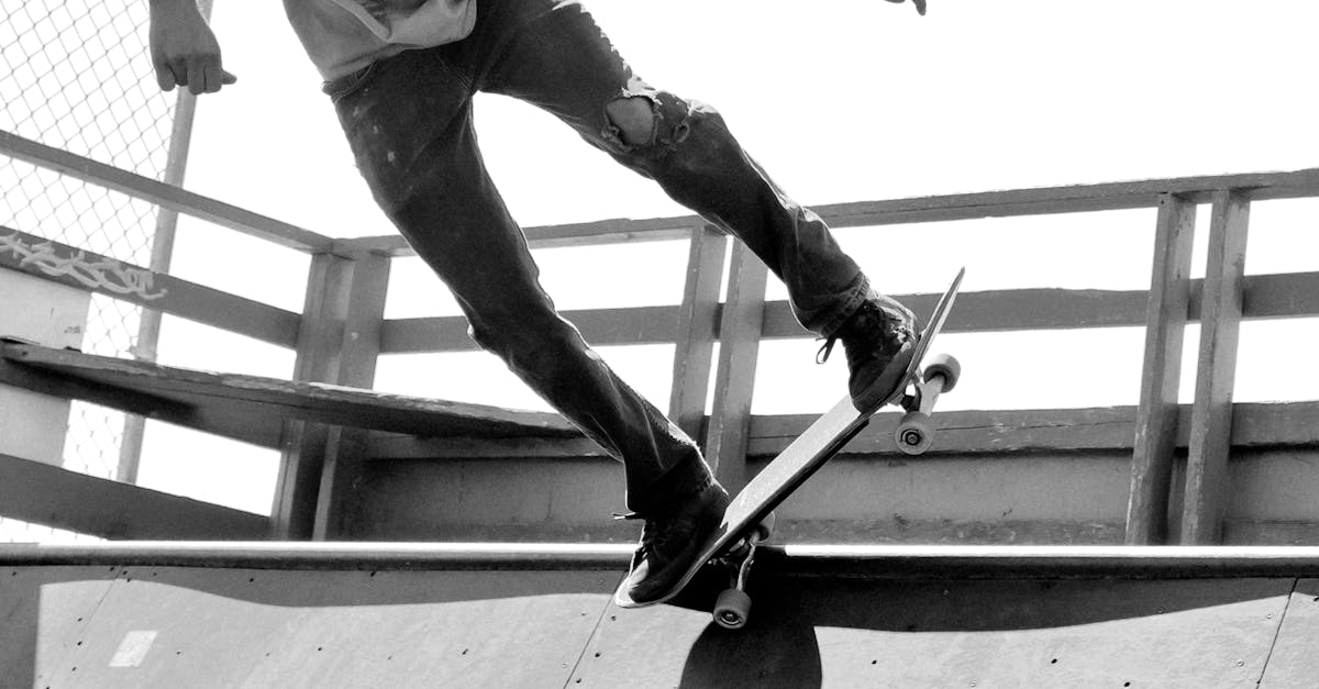 Grayscale Photography of Man Skateboarding on Ramp