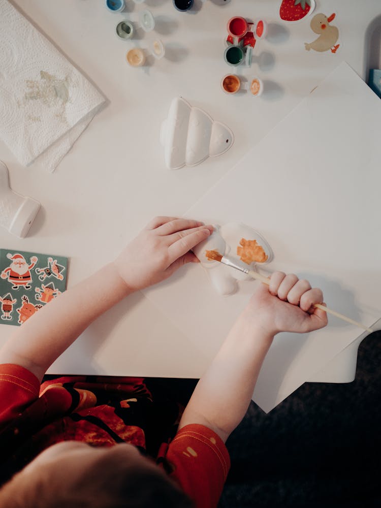 Child Painting With Brush