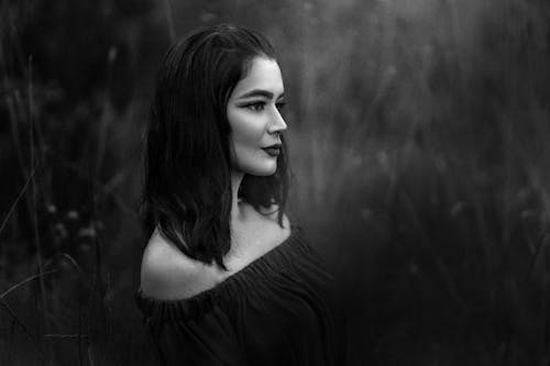 Grayscale Photo of Woman Wearing Off Shoulder Top