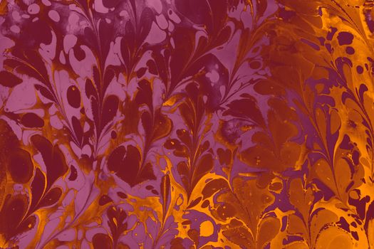Colorful abstract marbled pattern with swirling floral motifs in orange and purple tones.