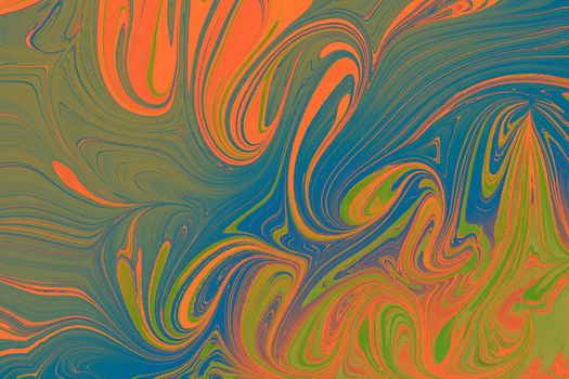 Colorful abstract swirl pattern with vibrant orange and green hues in liquid paint style.