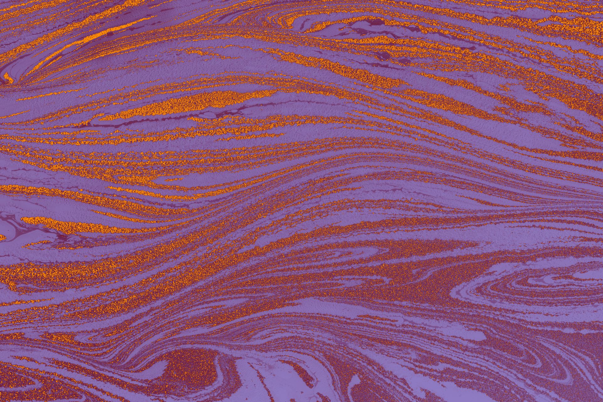 A purple and orange swirl pattern on a purple background