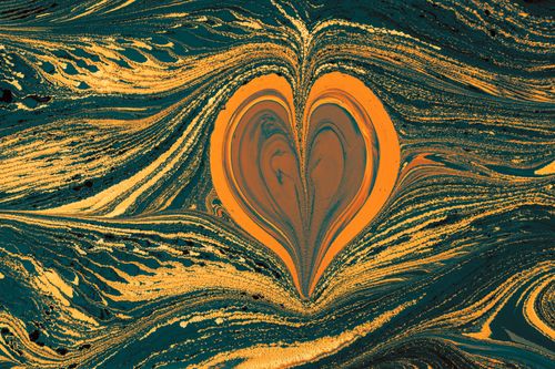 Free Vibrant heart-shaped pattern in swirling orange and teal marbling art form. Stock Photo
