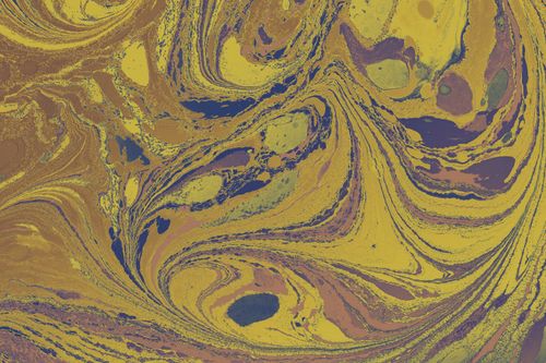 Free Vibrant abstract liquid marble texture with yellow and blue swirls. Stock Photo