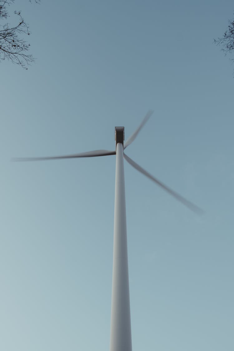 Windmill On Blue Sky Background