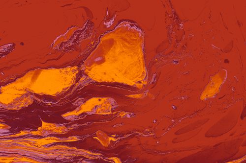 Free A bold and artistic abstract image featuring swirling patterns in orange and red tones, resembling colorful marble. Stock Photo