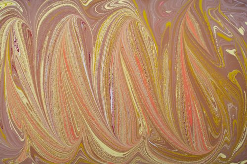 Free Vibrant marbled pattern with warm tones and swirling colors creating a dynamic abstract composition. Stock Photo