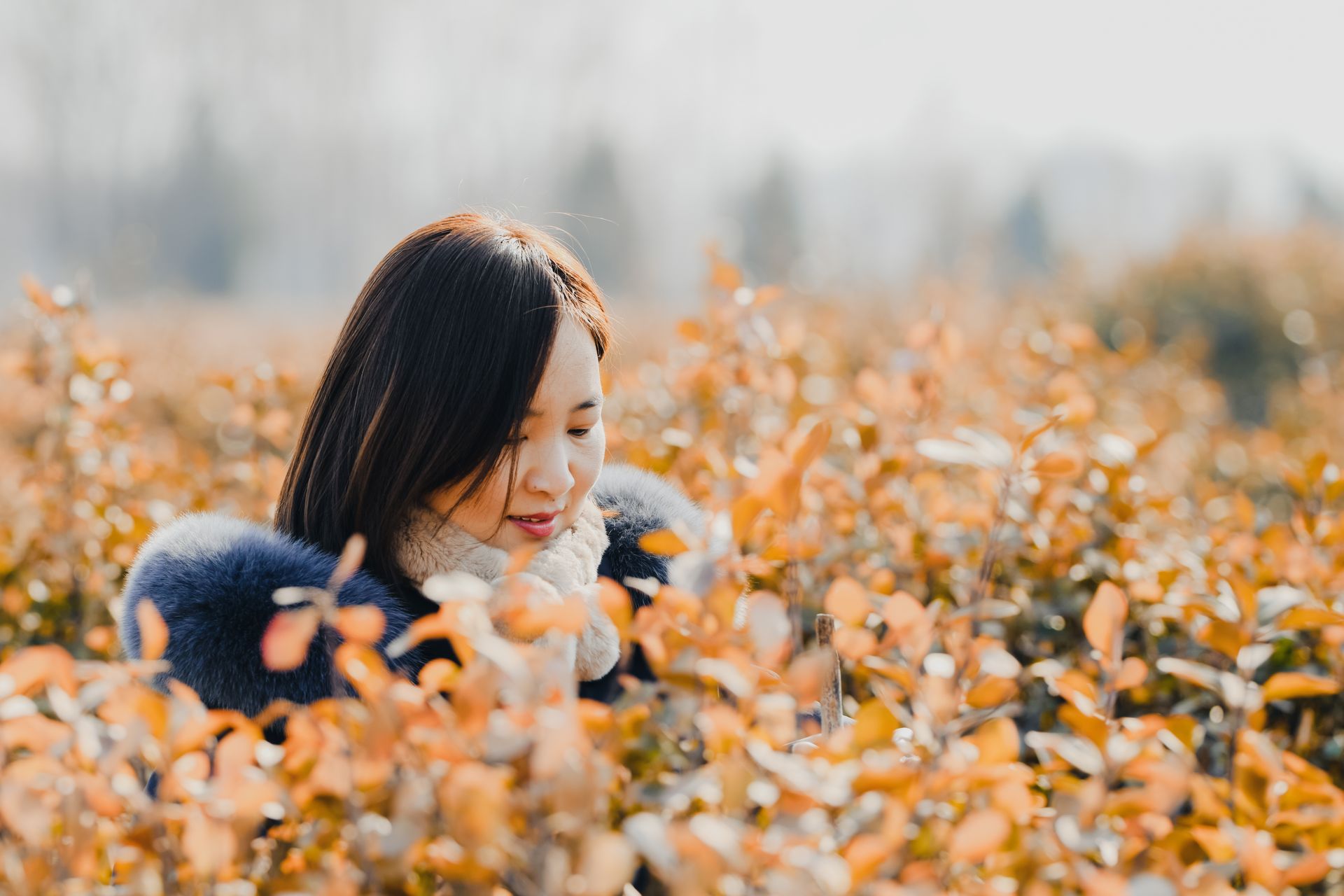 Woman in a Winter Jacket on a Field