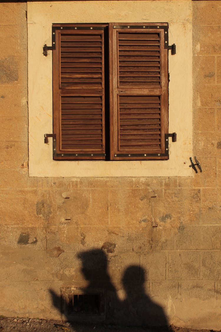 Old Rustic Wooden Window On A Concrete Wall