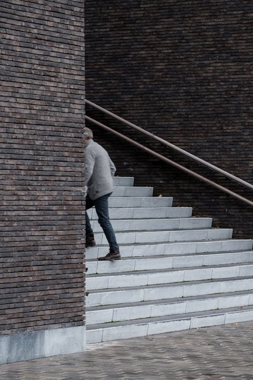 A Man Walking up the Stairs