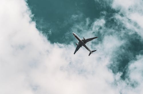 Free Flying Airplane on Sky Stock Photo
